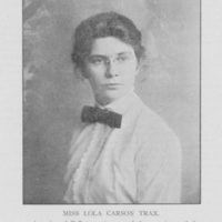 black and white image of a woman wearing wire rimmed glasses in a white collared shirt with a dark bowtie. Identified as Lola Carson Trax